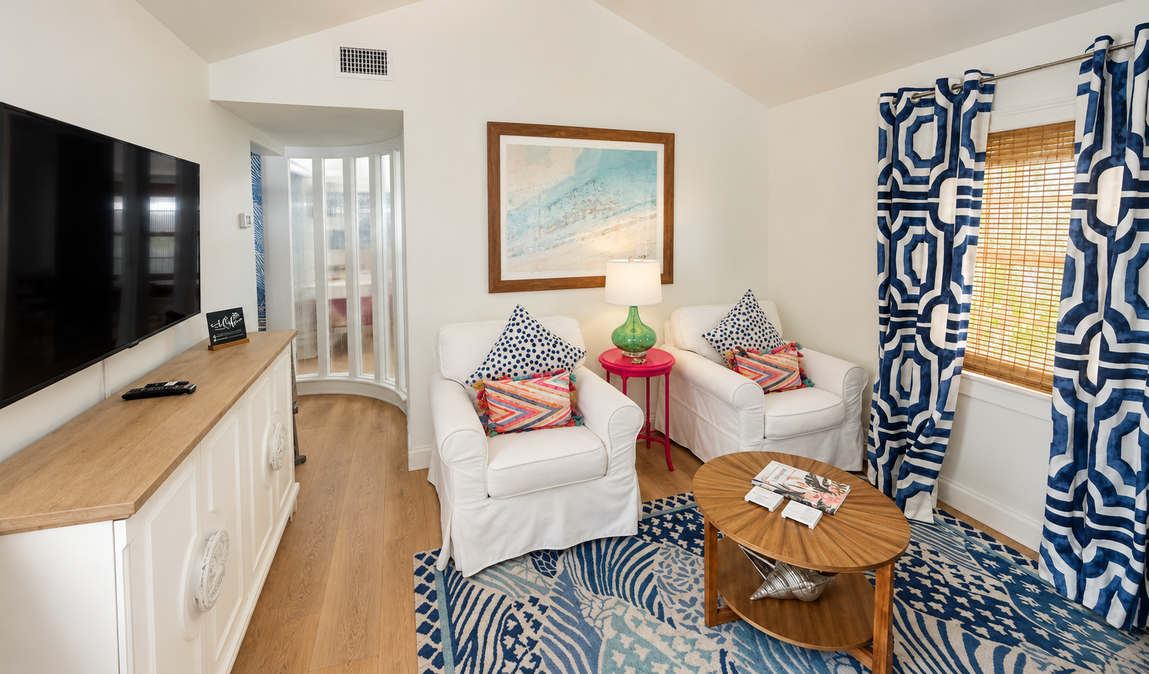 Living room seating area with colorful pillows